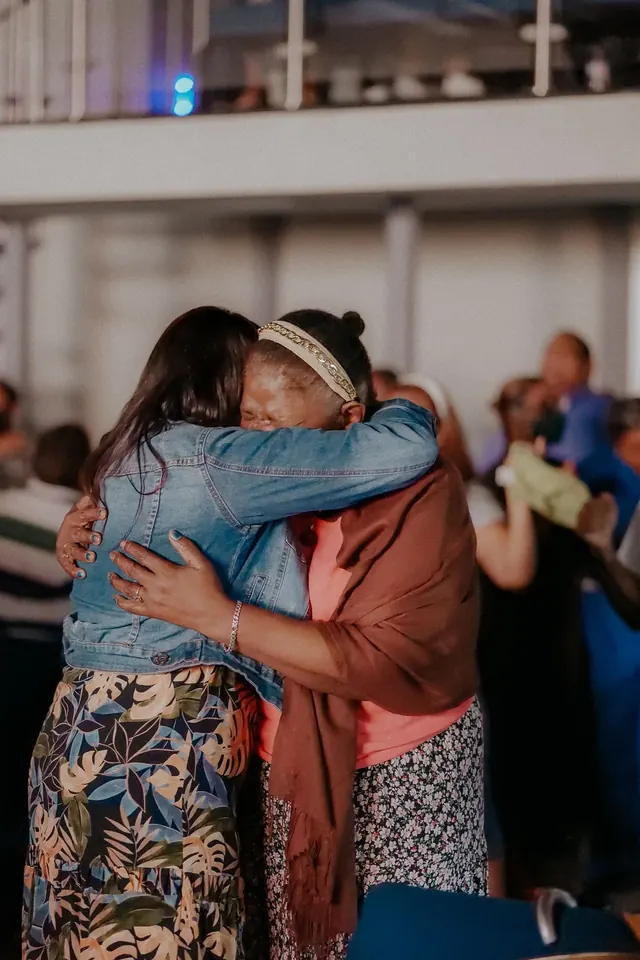 Two women sharing a warm embrace